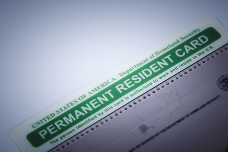 An editorial stock photo of a Permeant Resident Card also known as Green Card. Photographed using the Canon EOS 5DSR and the Canon 100mm f2.8 IS L lens.